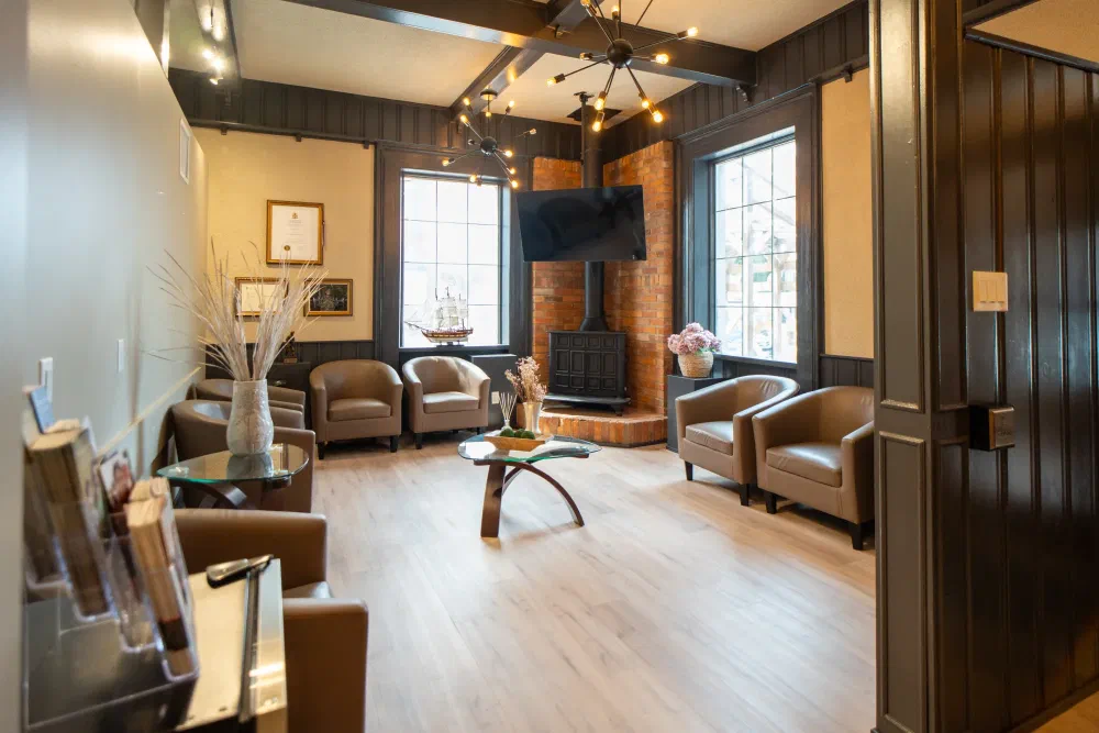 Waiting room at Cookstown Dental Centre with armchairs and natural light