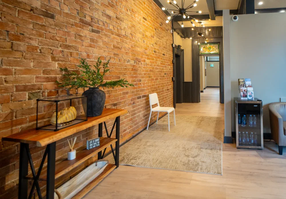 Welcoming entry hall with exposed brick at Cookstown Dental Centre