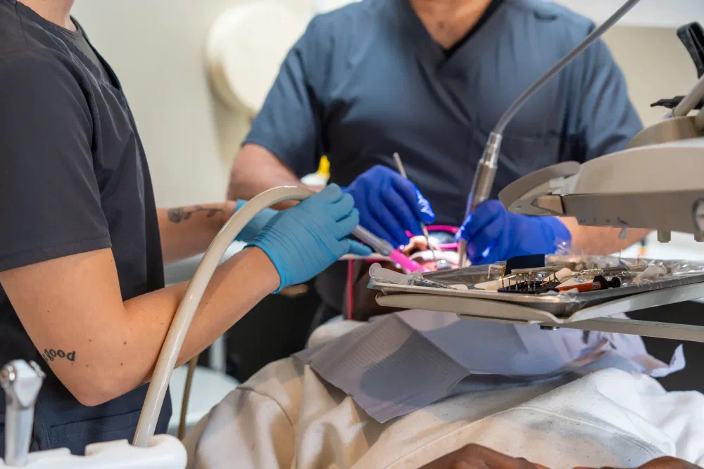 Dentist and assistant providing dental treatment in Cookstown