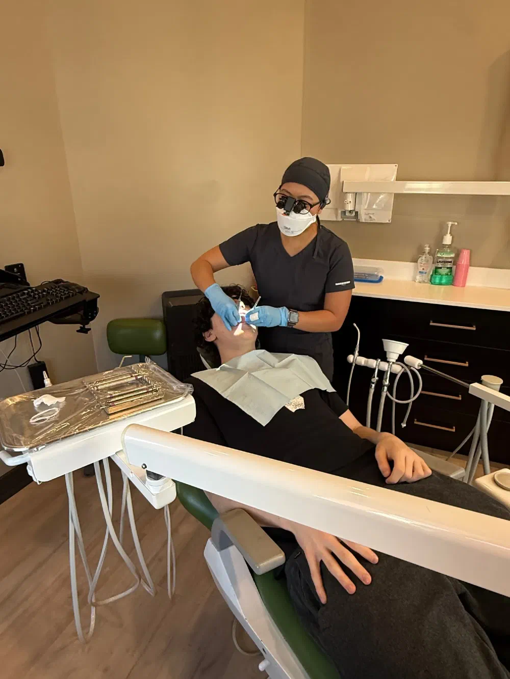 Dental hygienist caring for a patient in a Cookstown Dental Centre treatment room