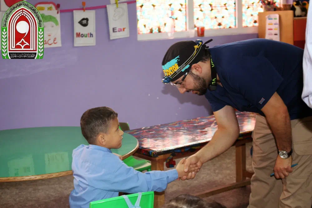 Cookstown dentist greeting a student during a children's dental outreach visit