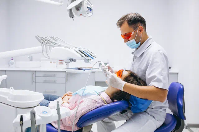 Patient receiving post-operative dental guidance