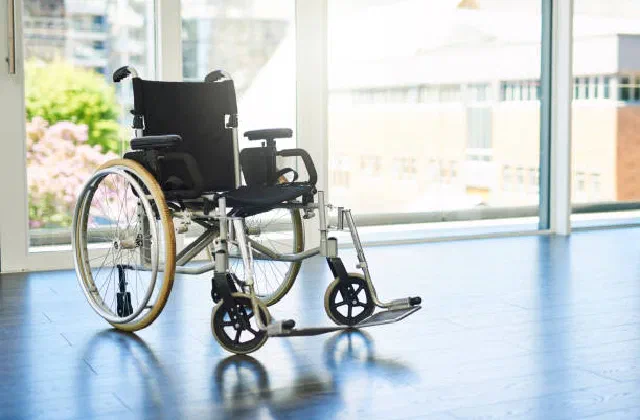 A wheelchair in a bright, accessible indoor space