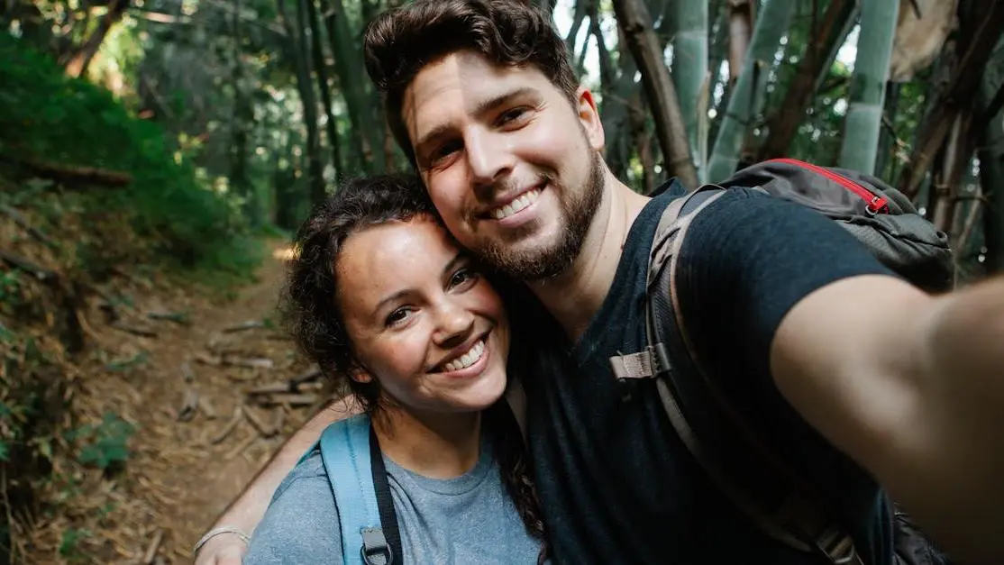 Joyful couple hiking, symbolic of flexible Invisalign payment plans.