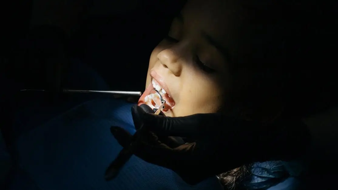 Child receiving dental checkup in Cookstown clinic, emphasizing children’s dental procedures.