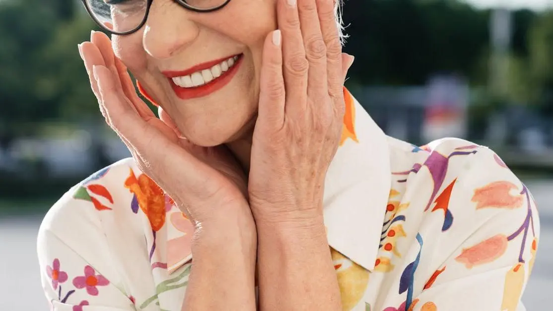 Smiling senior woman showing confidence, illustrating all-on-4 dental implant benefits