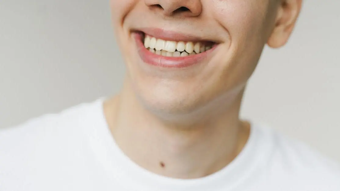 Invisalign for gapped teeth before and after results shown by smiling young man