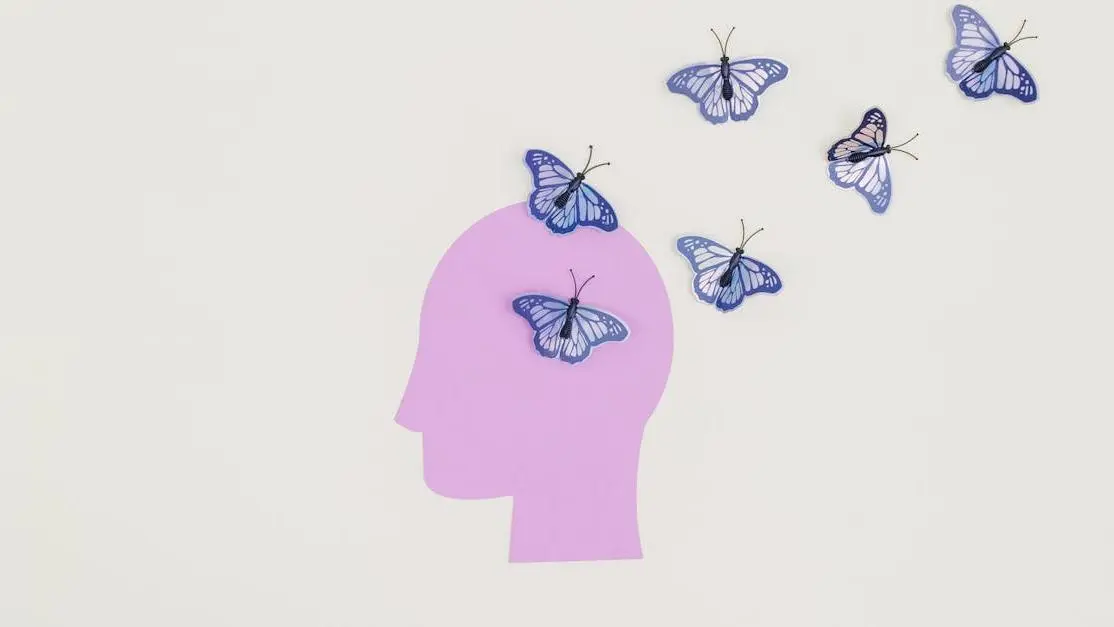 Butterflies emerging from a head silhouette symbolizing imagination for Thornton orthodontic services
