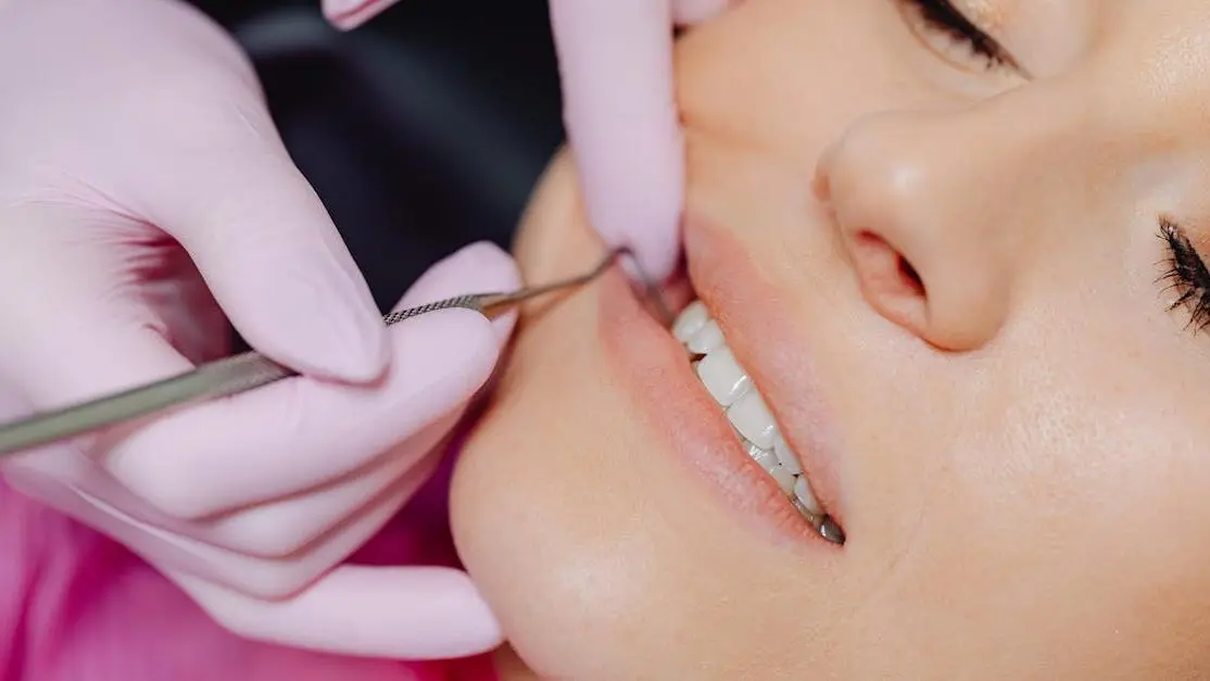 Dentist performing dental bonding procedure, illustrating dental bonding price for patients